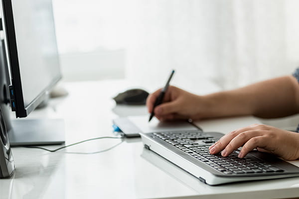 Hand on computer keyboard