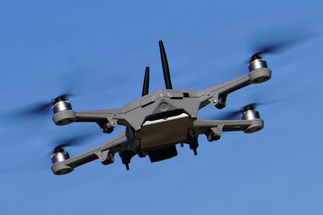 Small quadcopter unmanned aircraft system (sUAS) flying during U.S. Army training on medium-range reconnaissance drone platforms.