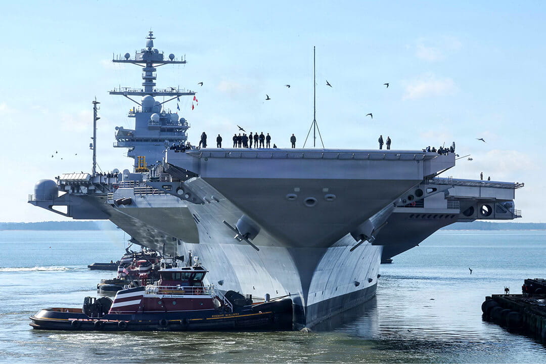 Pre-Commissioning Unit John F. Kennedy (CVN 79) departs Newport News Shipbuilding with tugboat assistance during builder’s trials to test ship systems at sea.