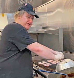 MCTI apprentice at a restaurant grill.