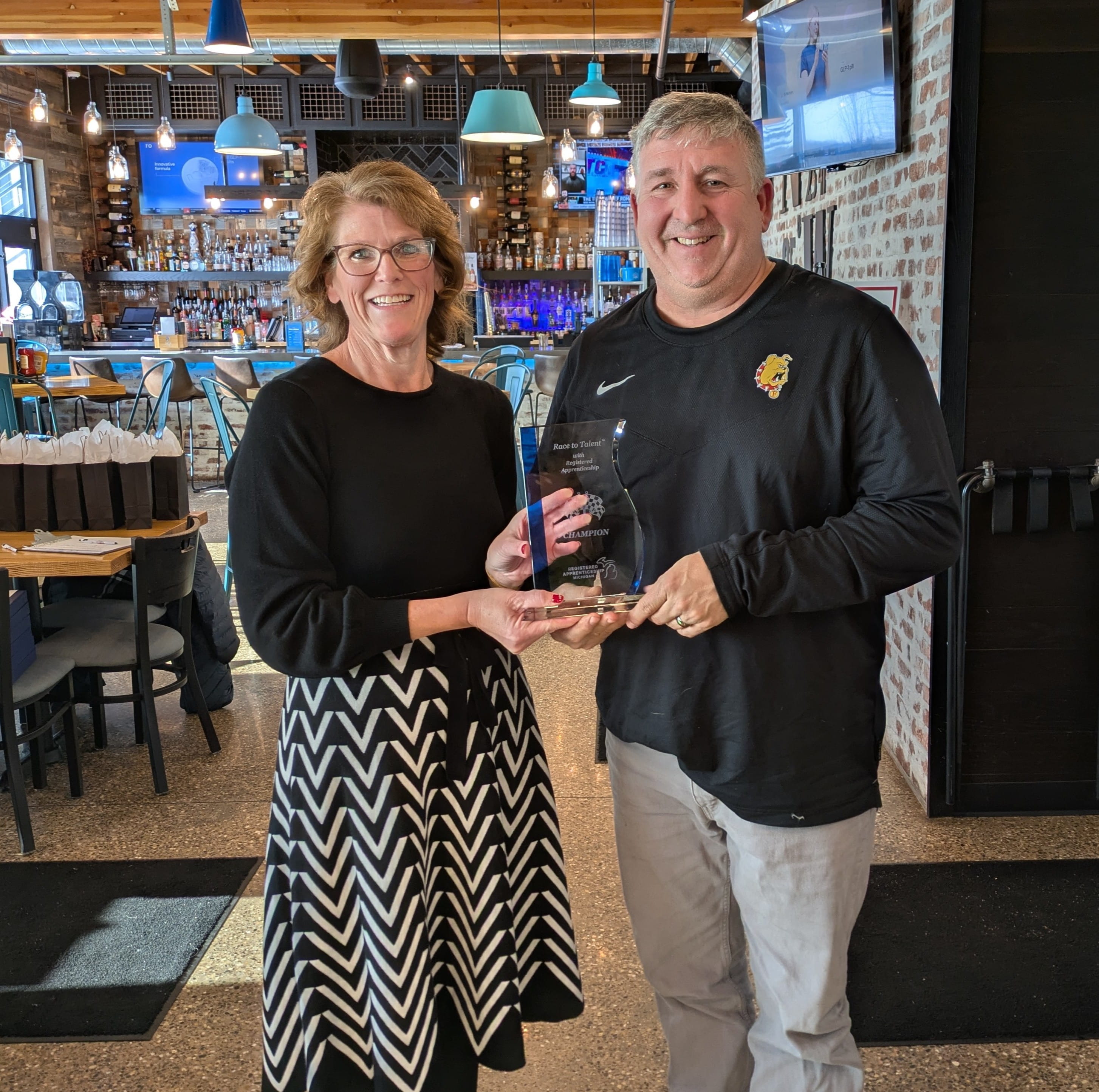 Shelly Keene handing an award to representative from Harbison Walker.