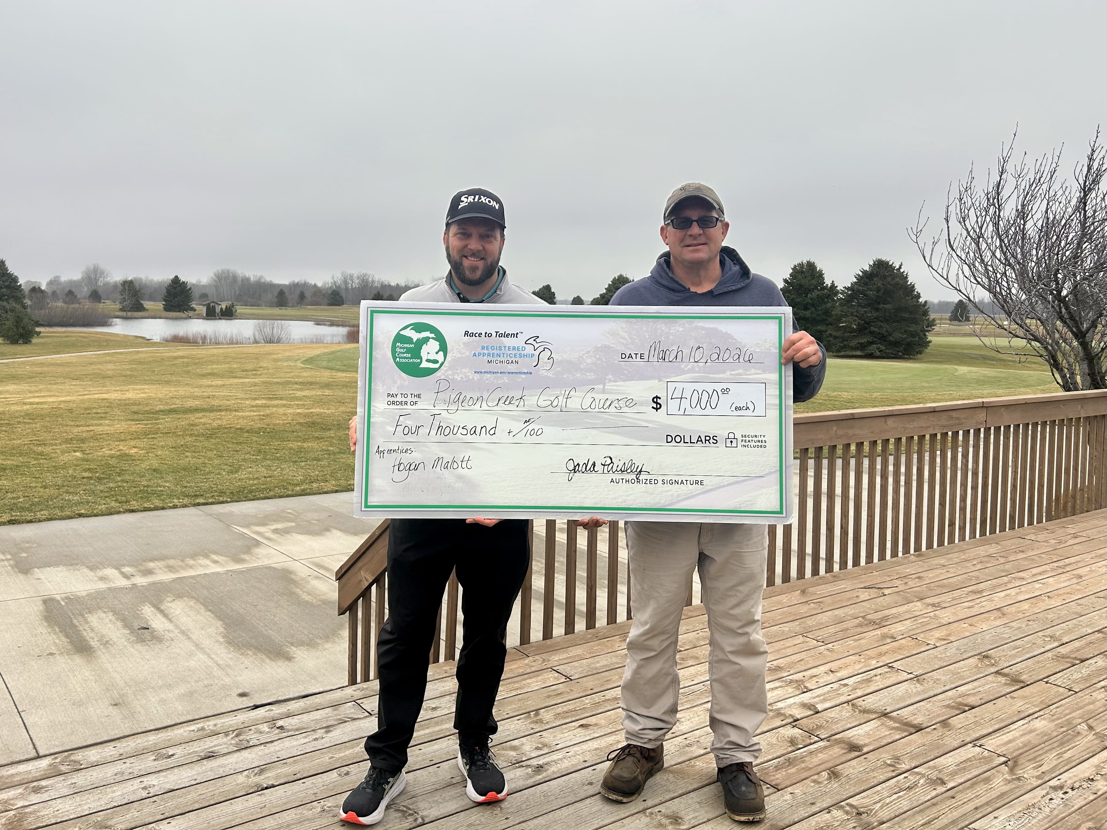Representatives from Pigeon Creek Golf Course holding up a $4,000 check.