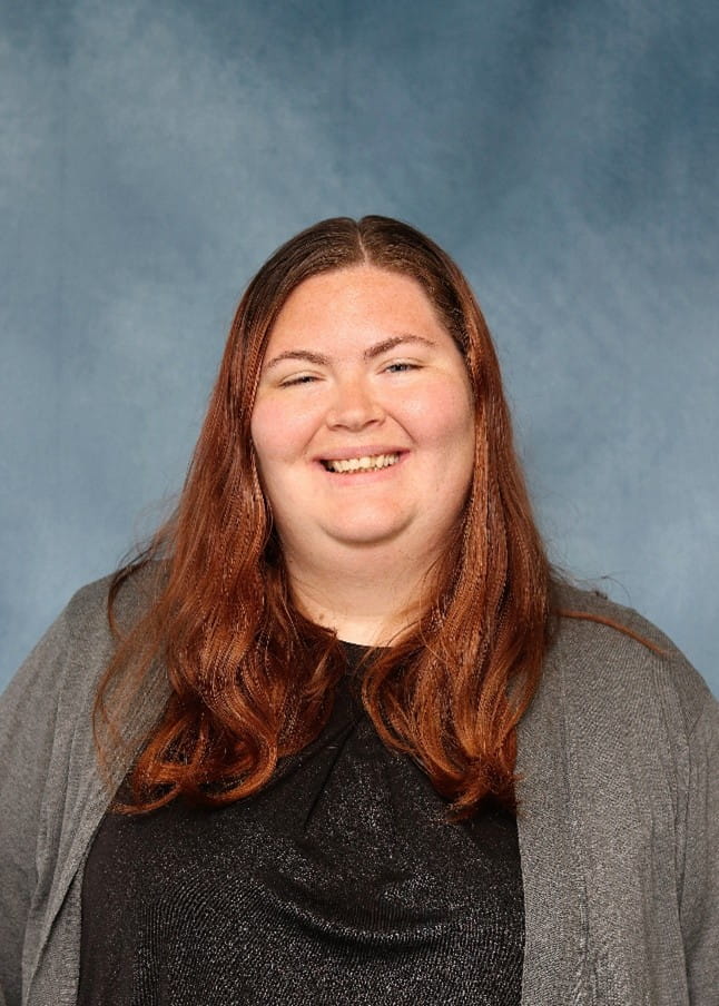 Kayla, a white woman with long brown hair