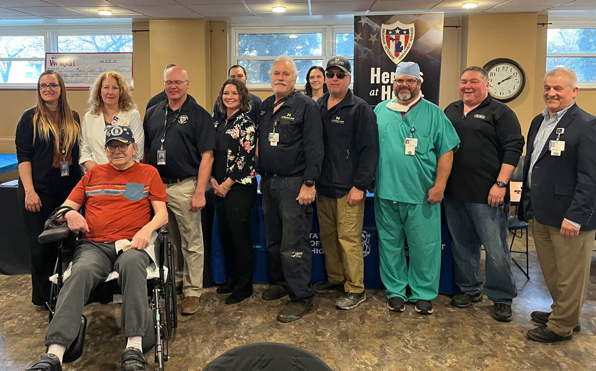 A group of veterans posing together for a photo during a MI-PCS-related event at Upper Peninsula Michigan Works!
