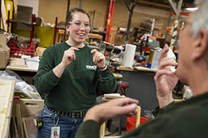 woman doing sign language MCTI