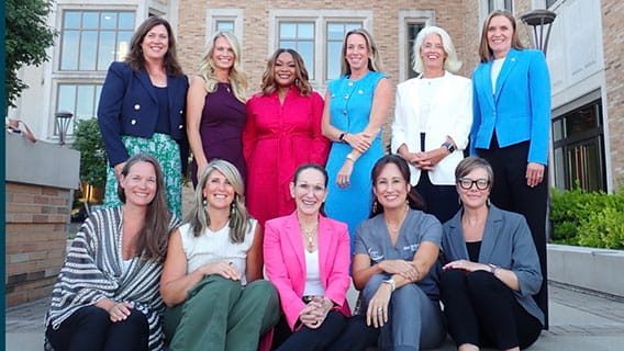 Grand Rapids panel poses for a group photo on the steps of the venue