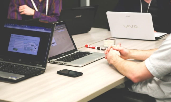 Researchers at table with computers