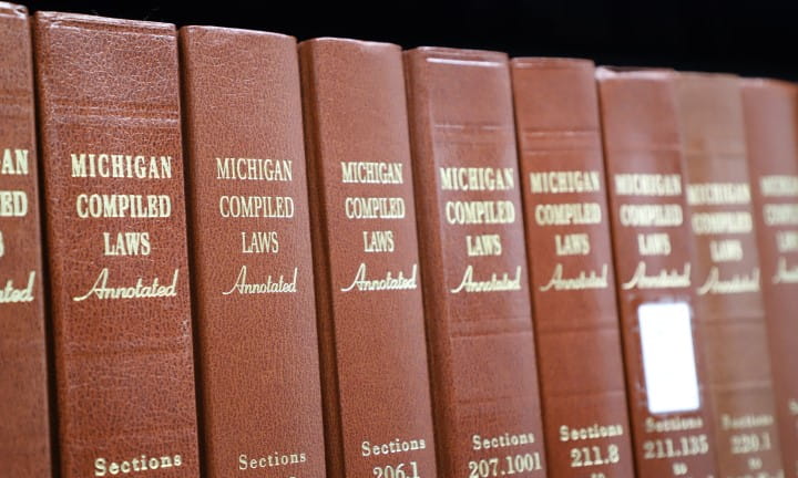 Statutes, Regulations, and Decisions link - Michigan Compiled Laws on shelves