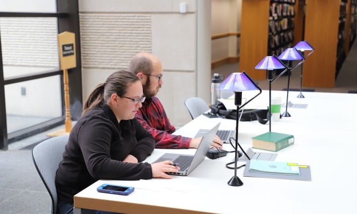 Library of Michigan Homepage For Public image Patrons at atrium table