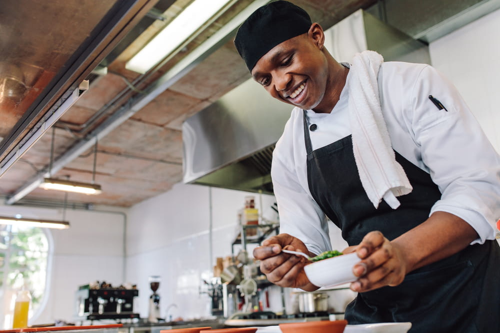 restaurant worker plating food
