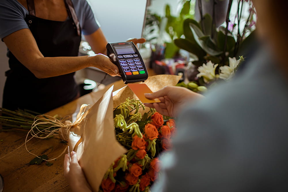 customer making card payment flowers