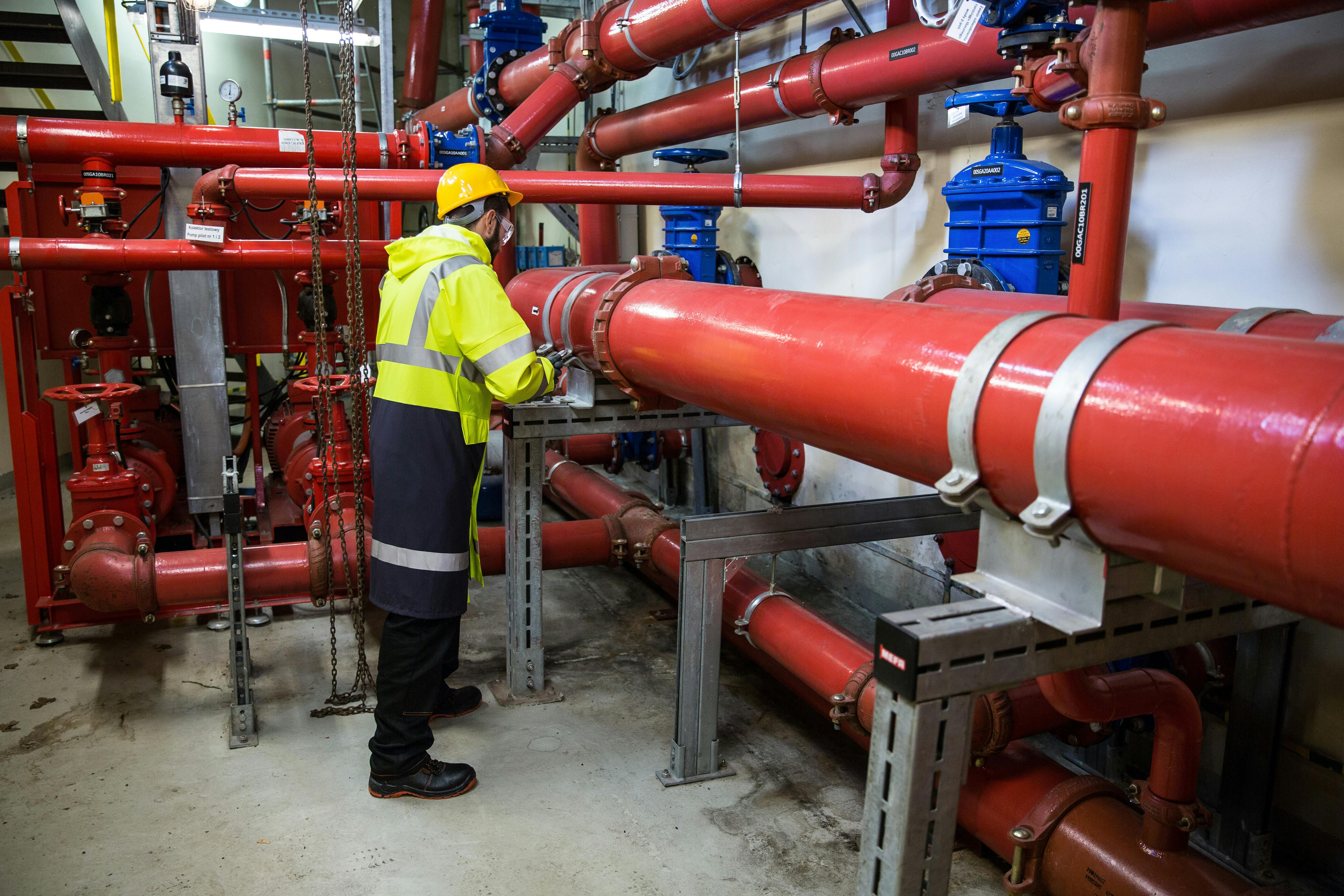A person working with pipes.