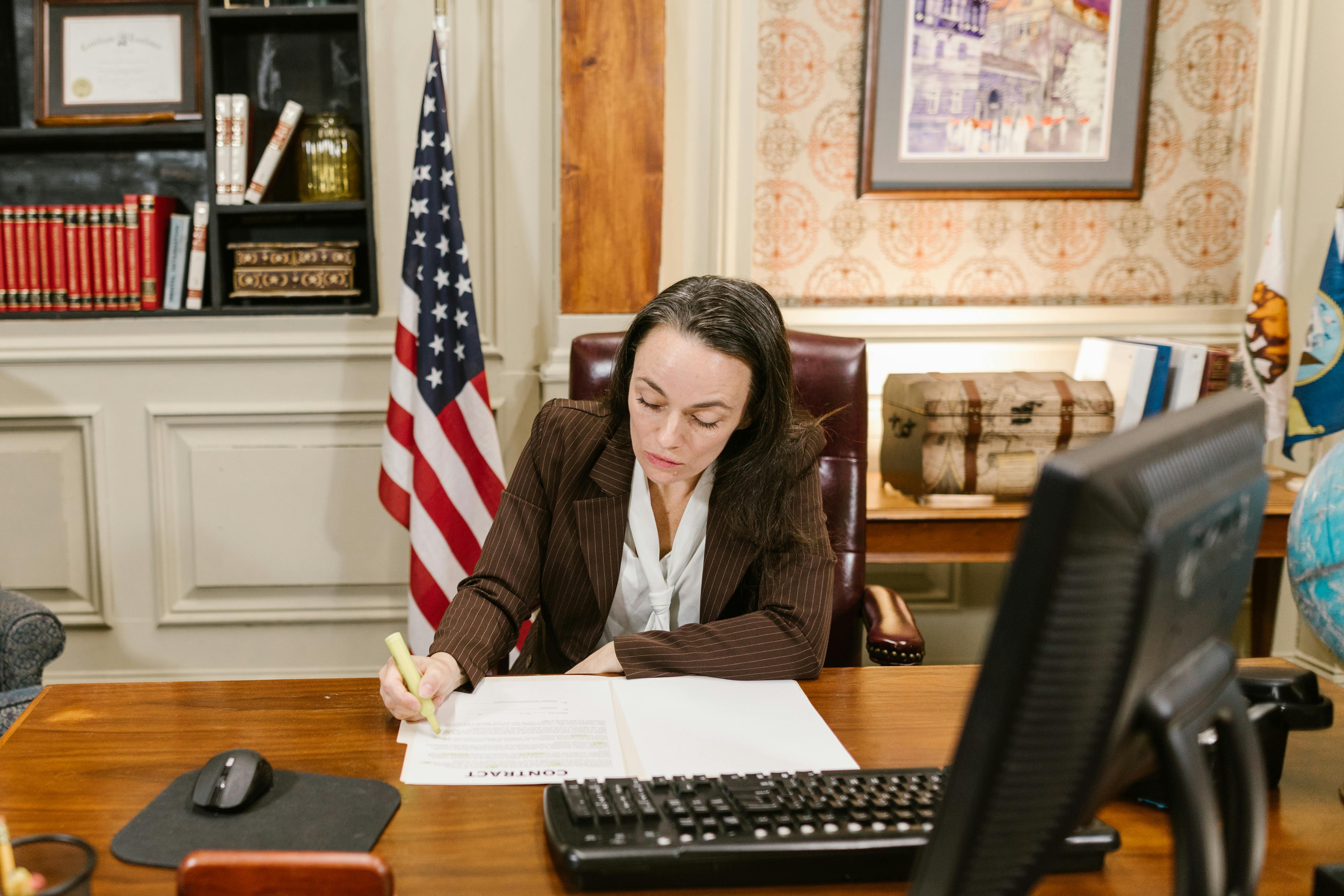 A lawyer writing on a document.