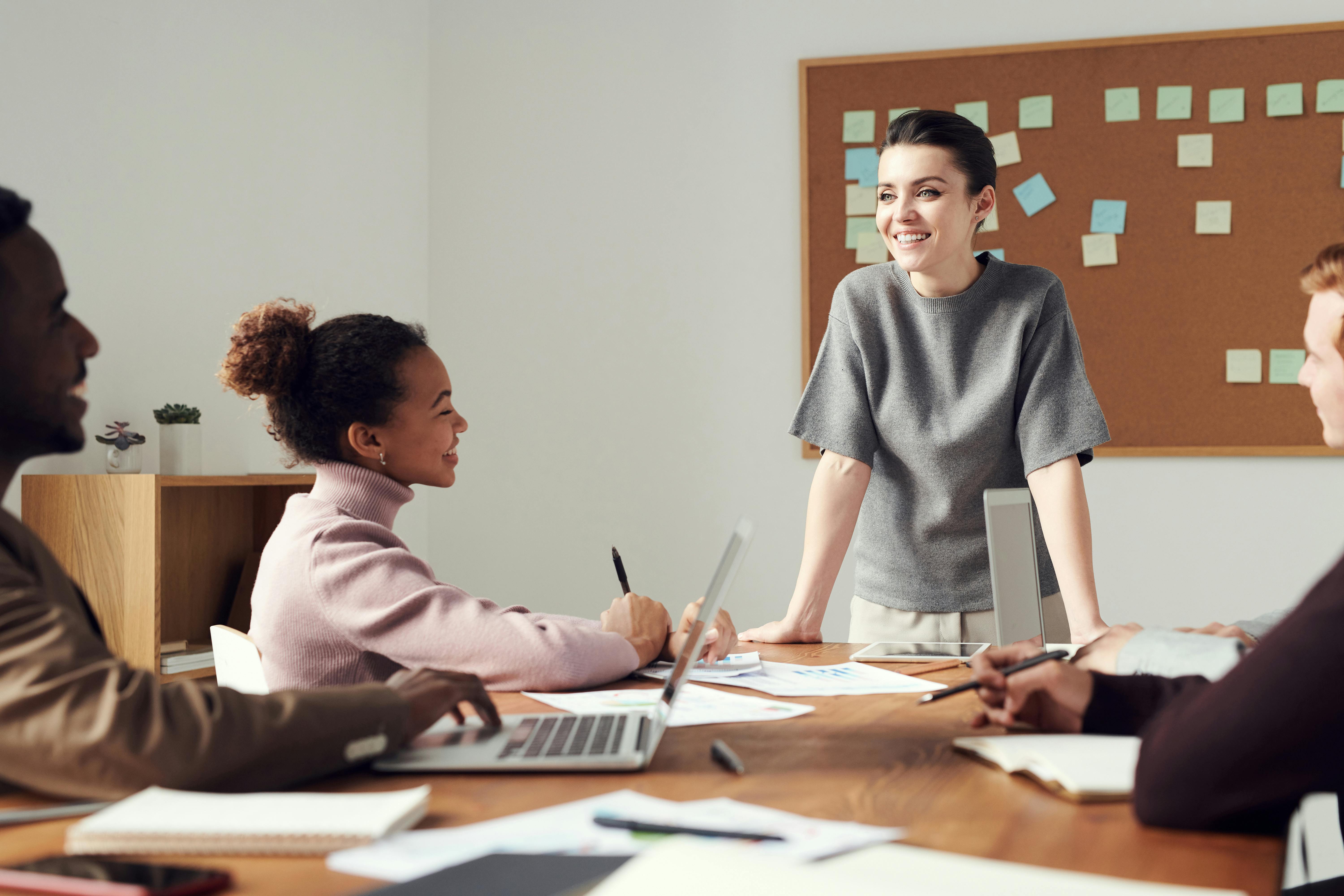 Four people working together during a meeting.