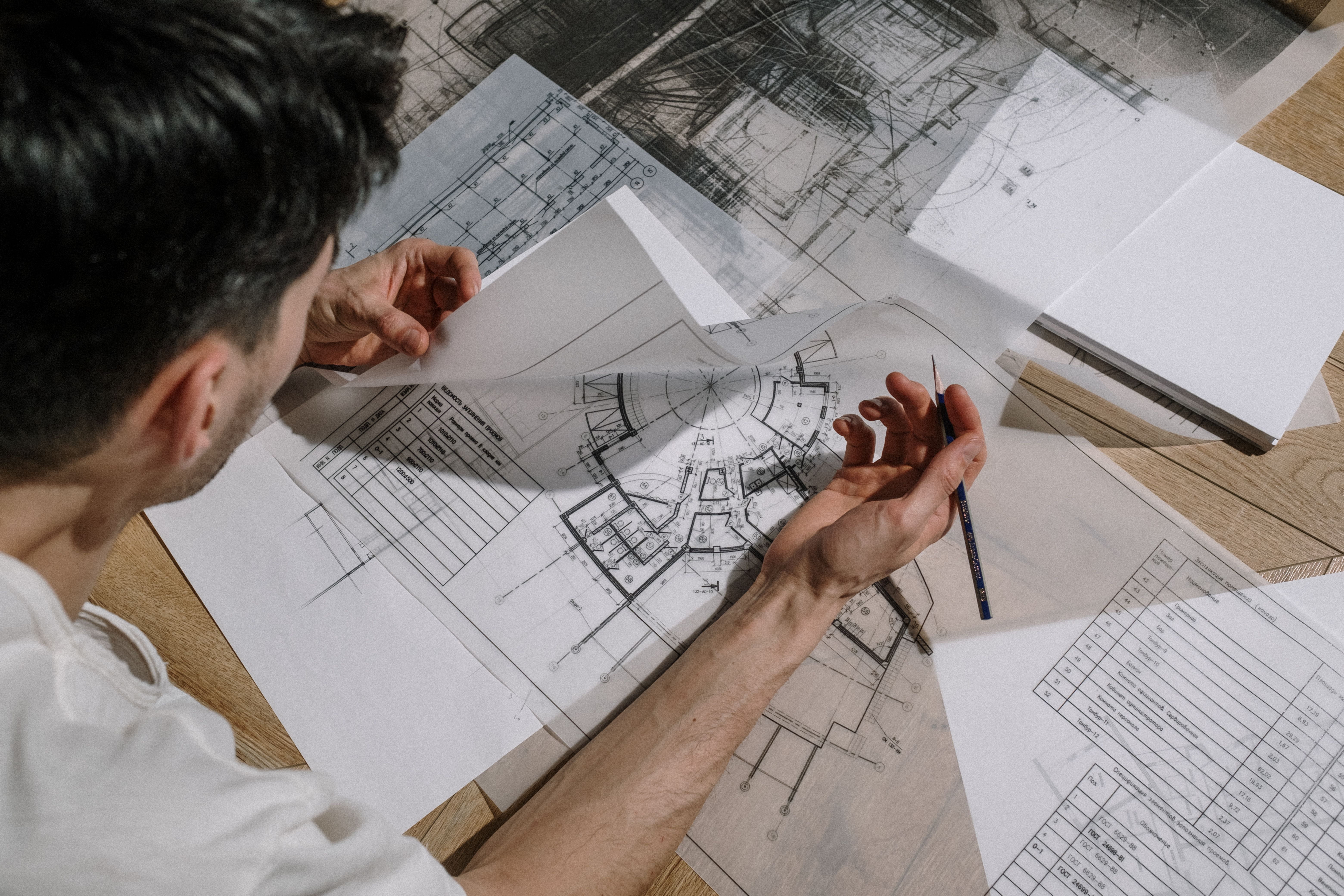 architect studying blueprints