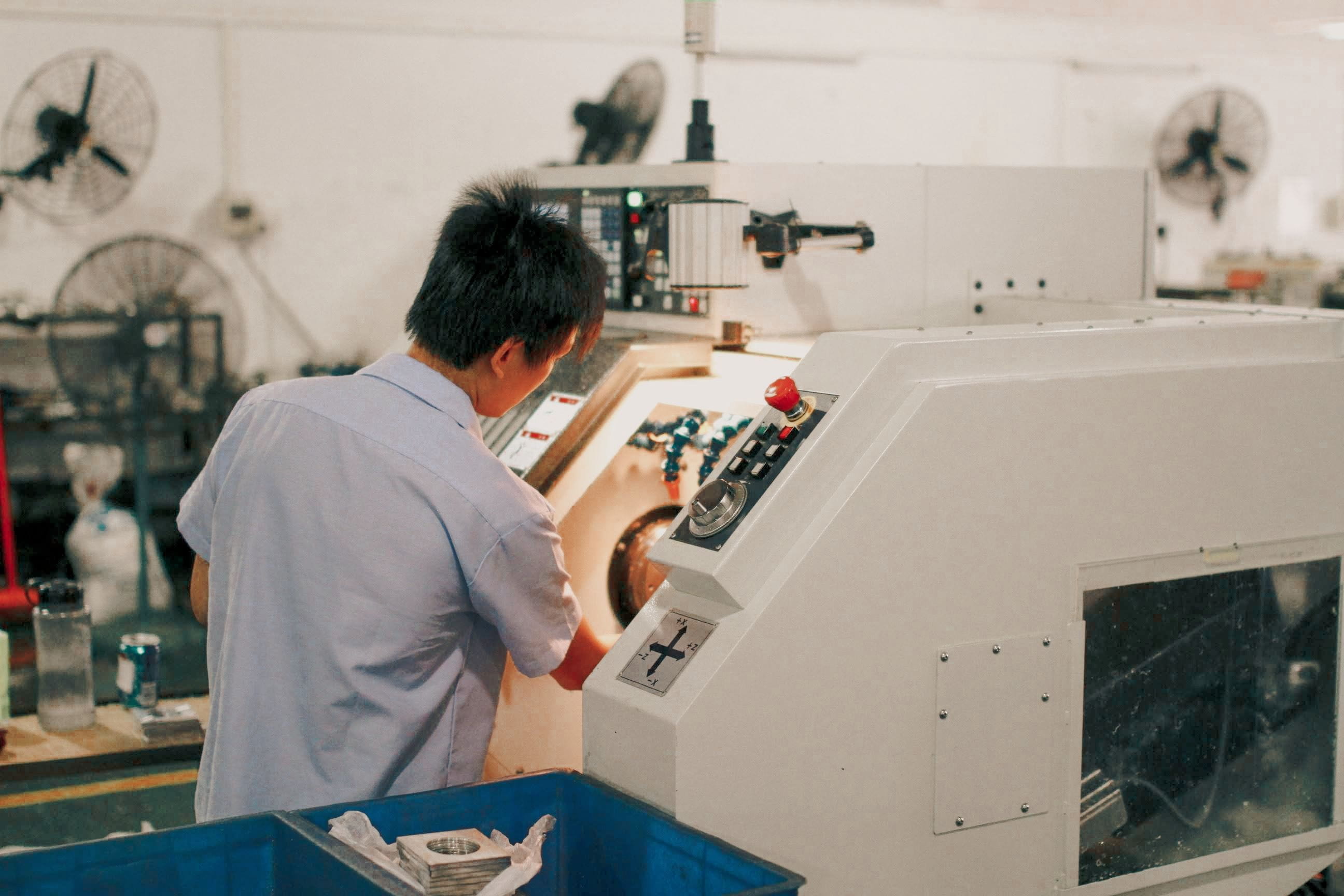 man operating industrial machinery