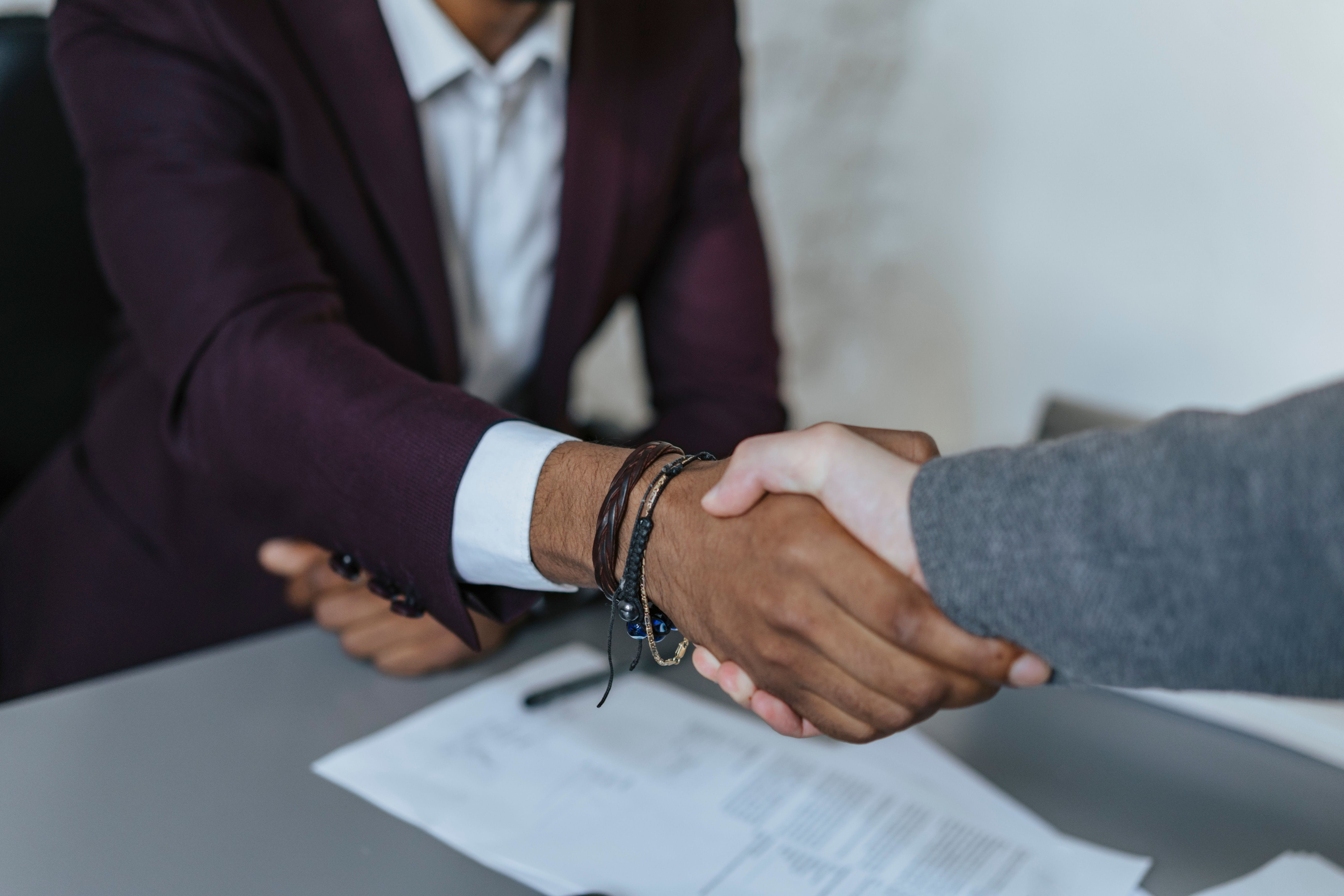 Two people shaking hands.