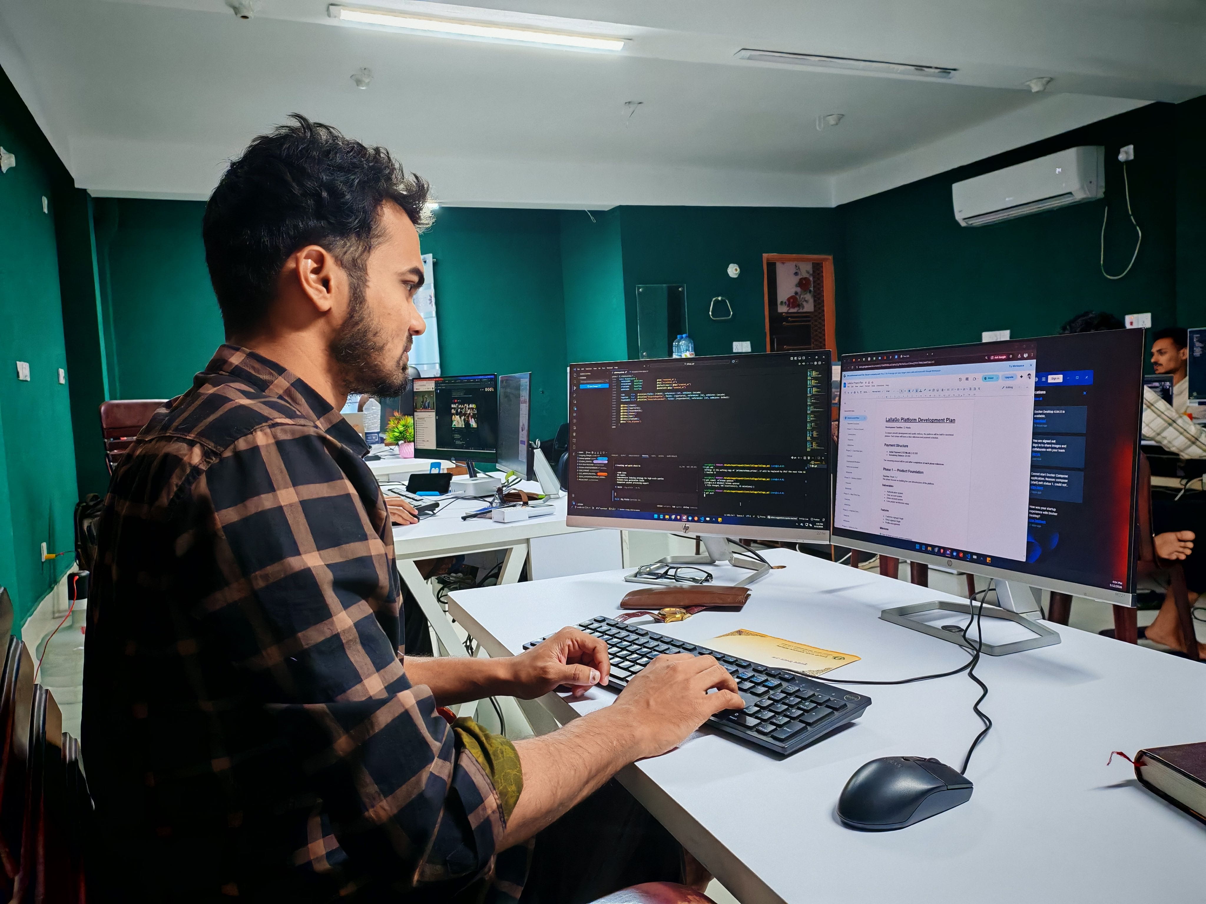 software developer working on a code on a computer