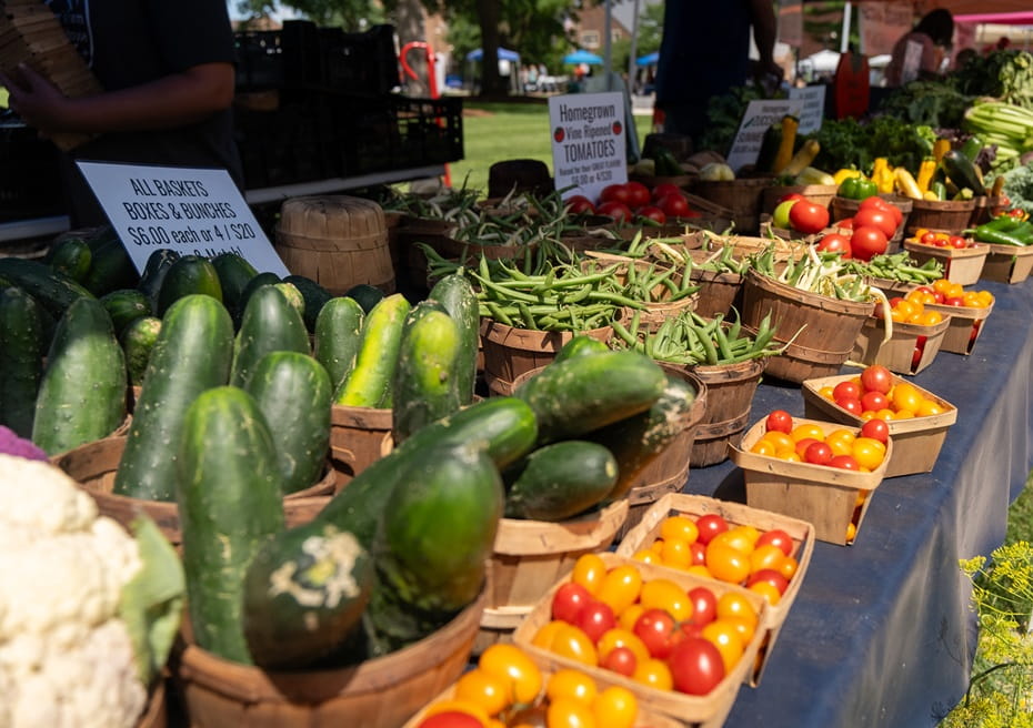 Vegetables and herbs sold at a farmer's market.
