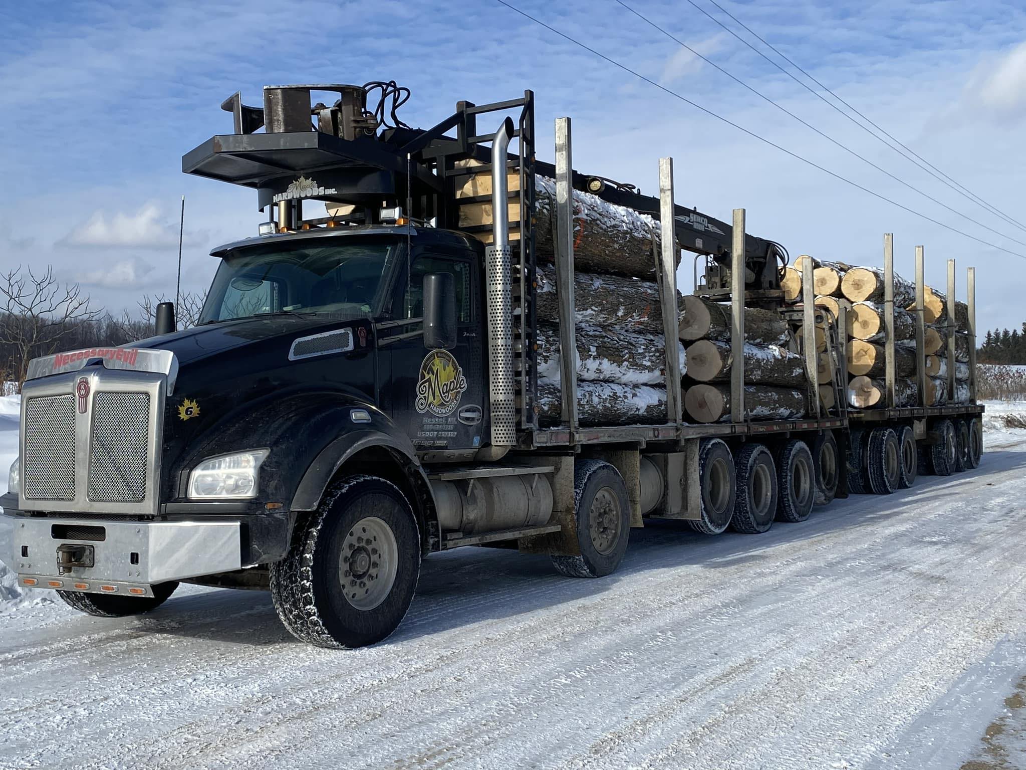Image of Maple Hardwoods, Inc. logging truck full of logs.