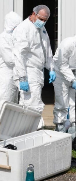 People in full body protective gear.