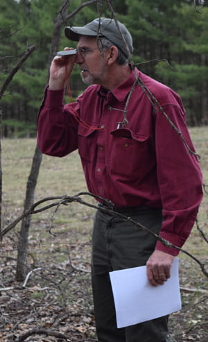 Eric Brandon, FAP Forester, Alcona Conservation District, obtaining stand density measurements