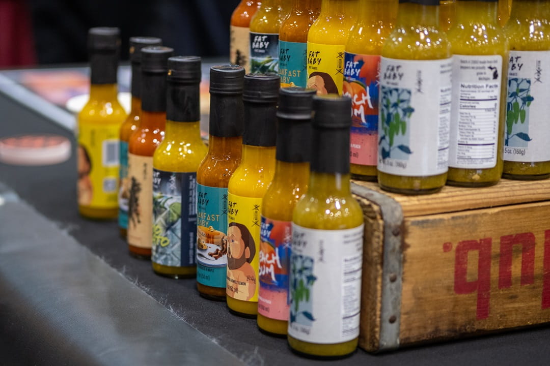 A variety of colorful hot sauces.