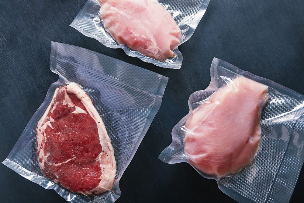 Several cuts of meat that are vaccuum packed in a reduced oxygen environment