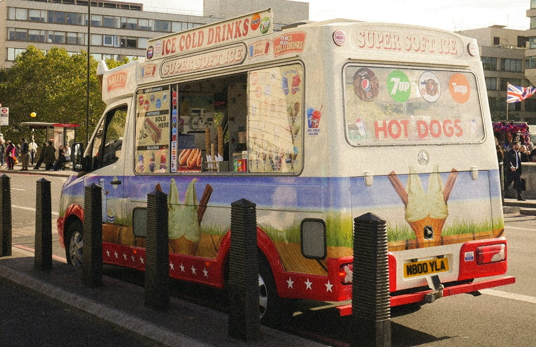 A restaurant food truck parked on a street open for business