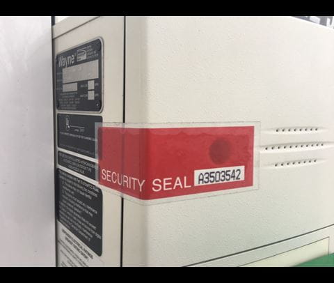 Intact tamper proof tape on a fueled pump