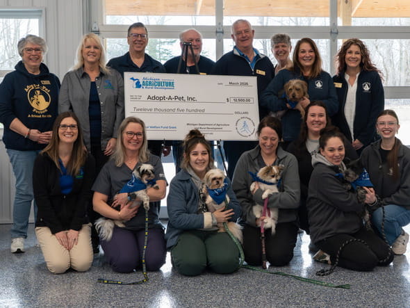 MDARD staff posing with animals at animal shelter for Animal Welfare Fund.