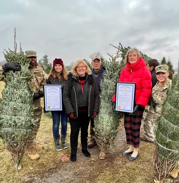 MDARD Deputy Director Kathy Angerer presenting the Michigan Christmas Tree Month proclamation at the Trees for Troops event