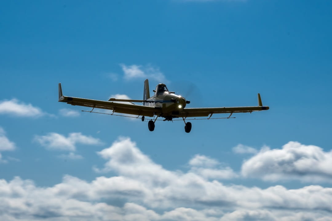 Aerial pesticide application plane flying