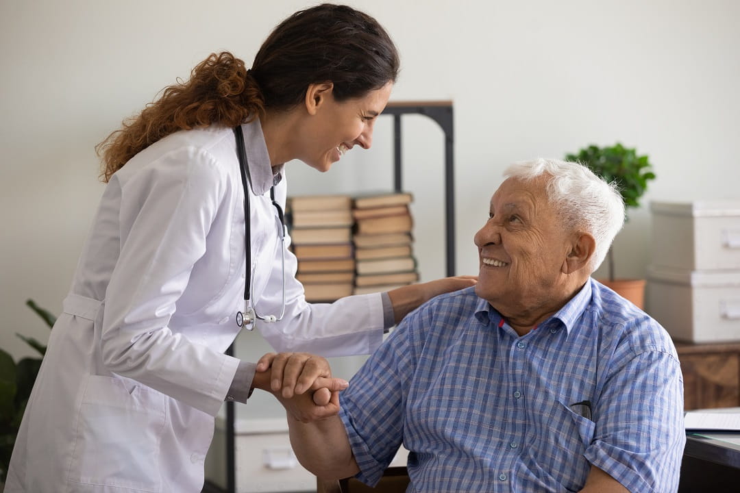Doctor talking to elderly man