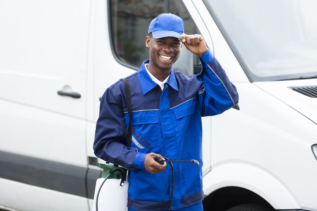 Pesticide applicator next to van
