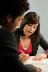 Woman Writing during meeting