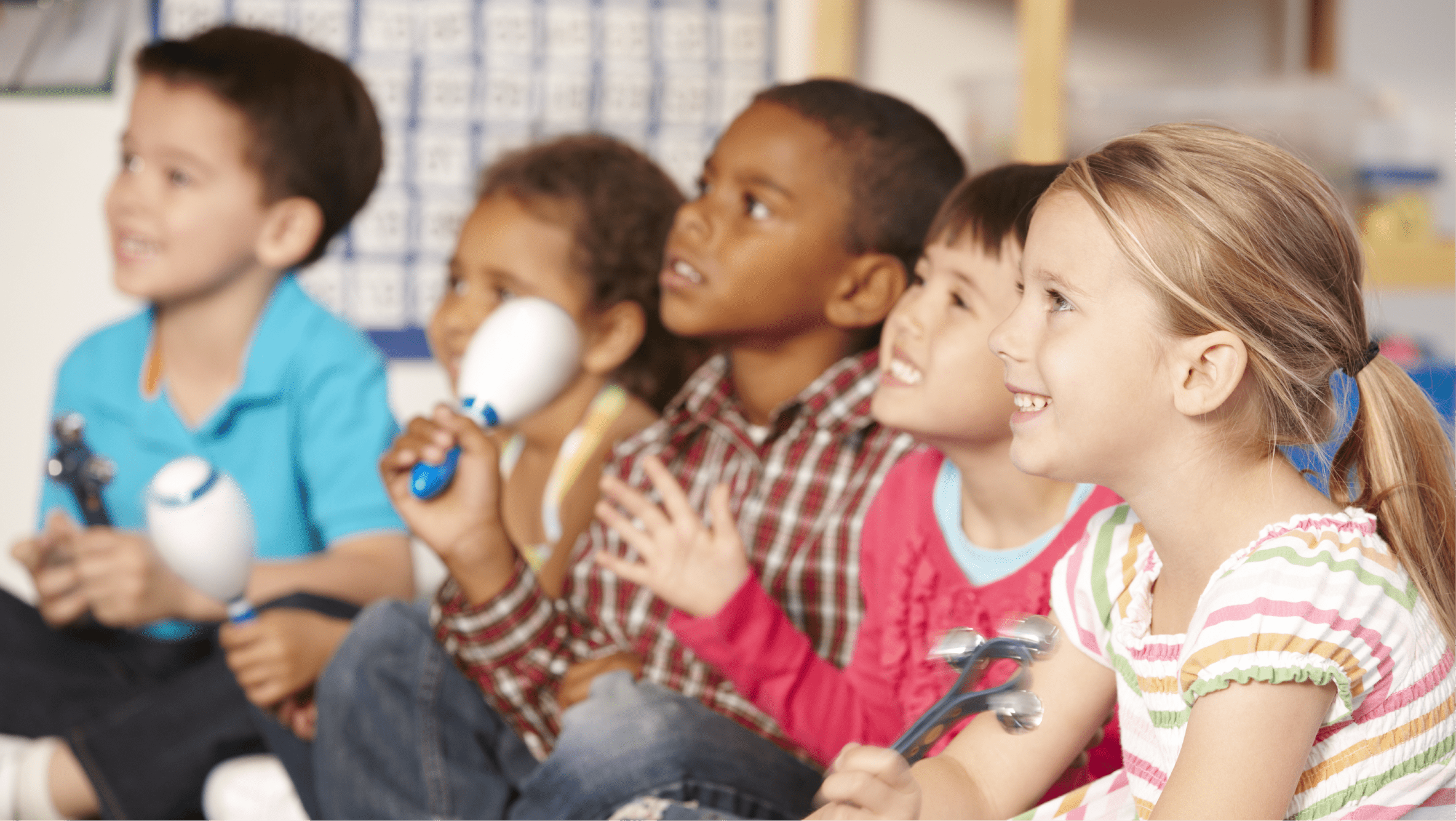 Diverse group of elementary students seated in a circle playing various percussion instruments.