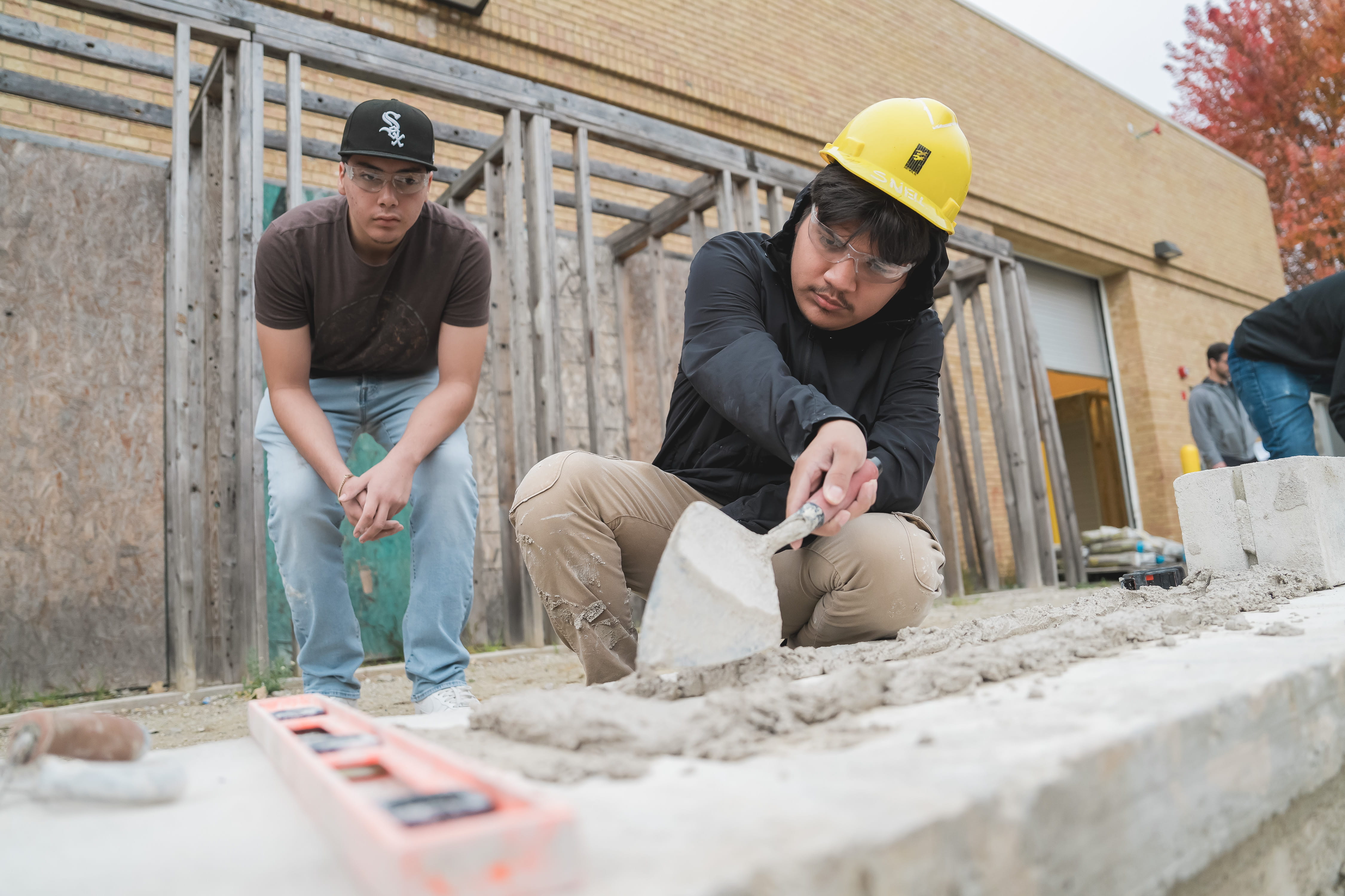 Two CTE students working on a construction project. 