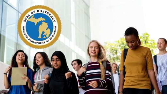 Diverse group of high schoolers walking down stairs on their way to class.