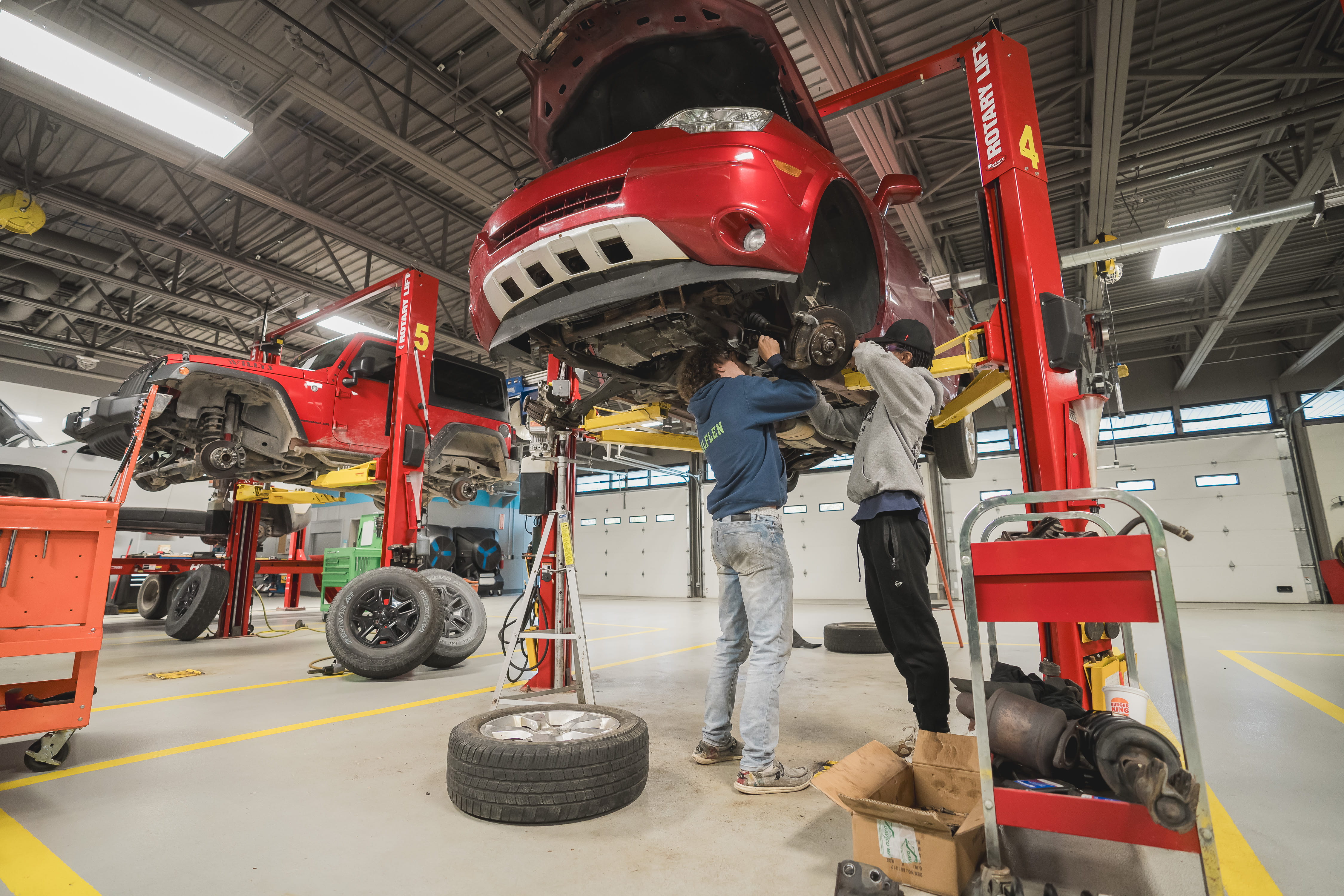 CTE automotive students working on a car