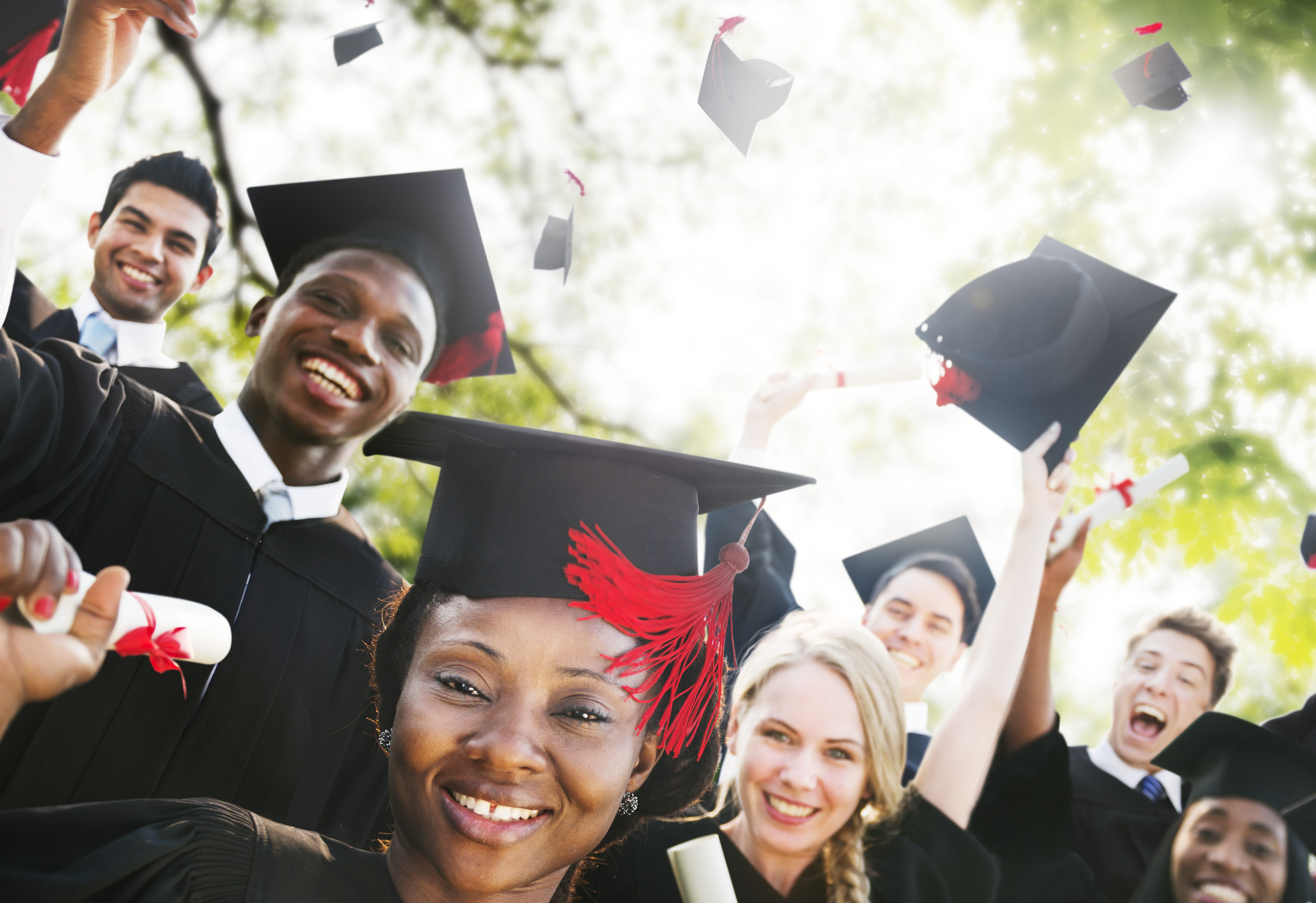 Diverse group of students celebrating graduation