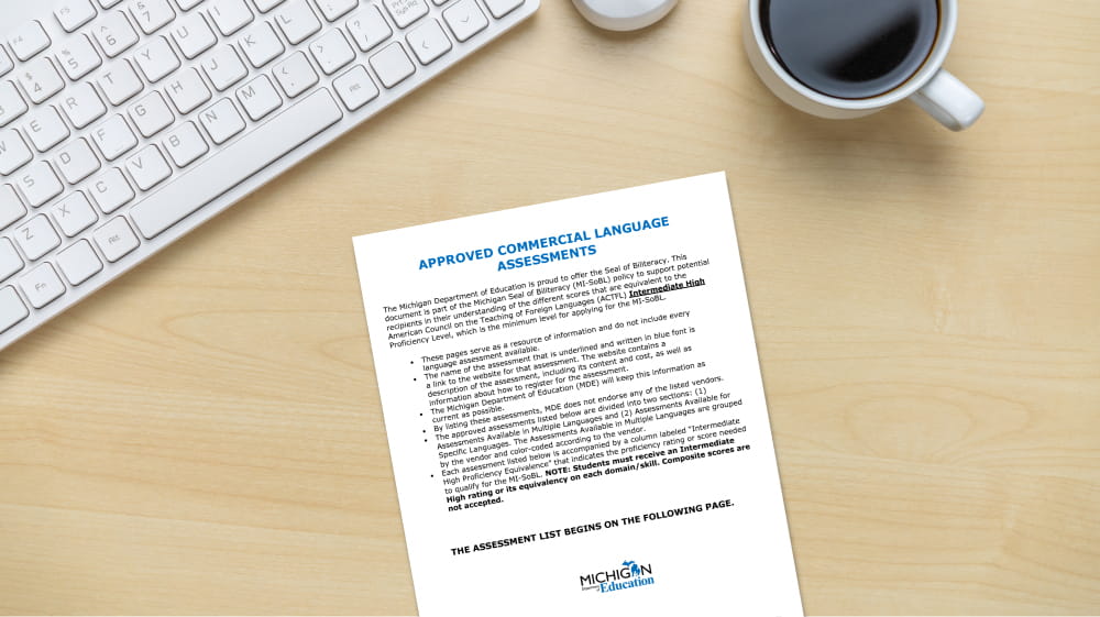 Approved Commercial Language Assessments document one a light colored wooden desk