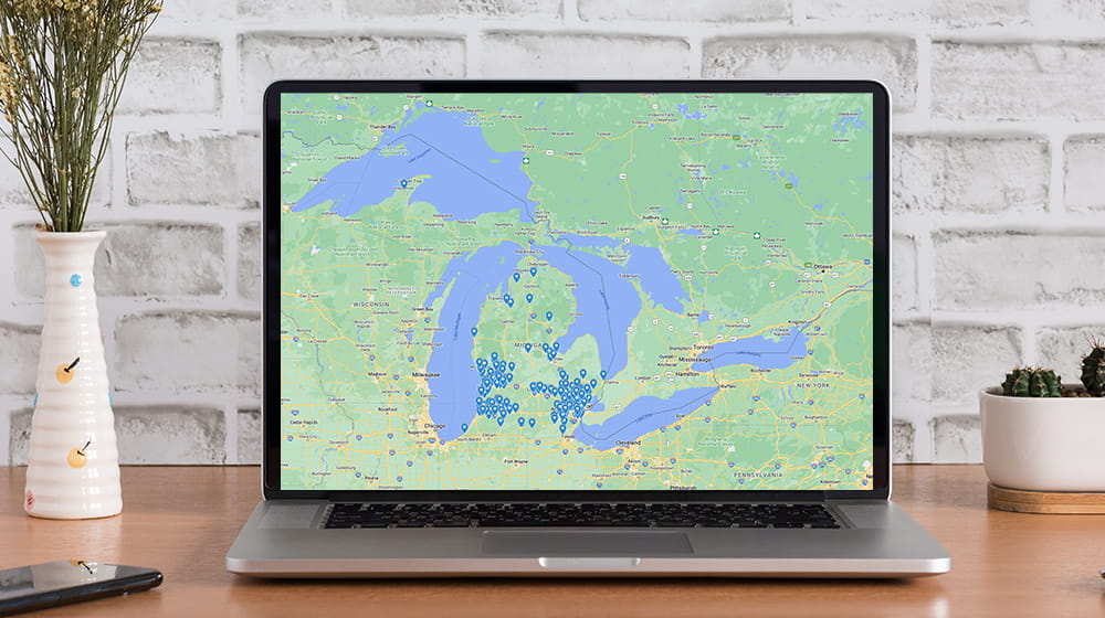 Laptop with map of Michigan on screen.
