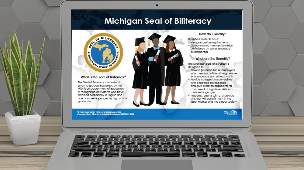 Michigan Seal of Biliteracy Poster on screen of laptop on desk.