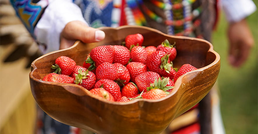 Wooden bowl filled with strawberries