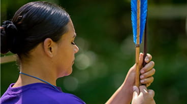 Native woman holding arrow