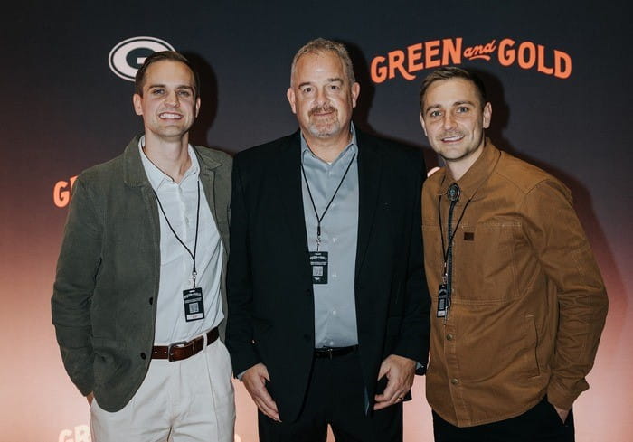 Three men standing side by side