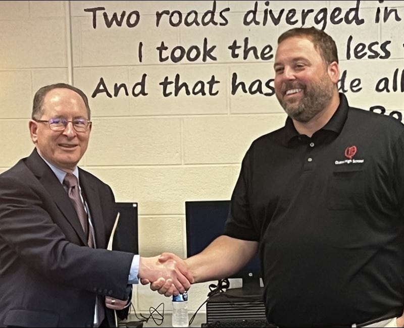 2 men shaking hands