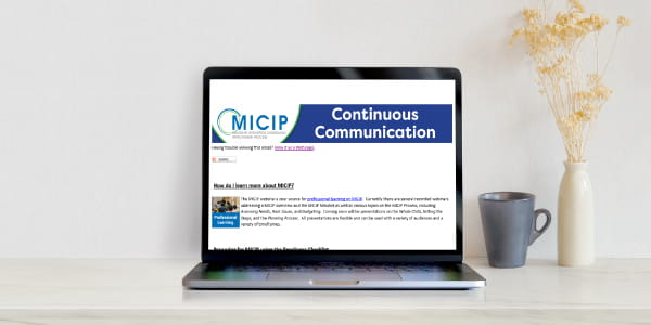 Laptop open to MICIP Continuous Communication Newsletter website.