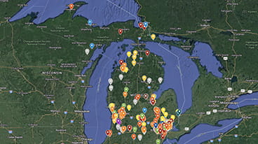 Map of Michigan with markers for each public school academy.